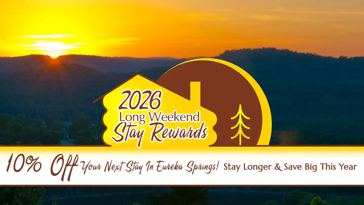 Promotional graphic for a 10% discount on stays in Eureka Springs during long weekends in 2026, with a sunset backdrop.